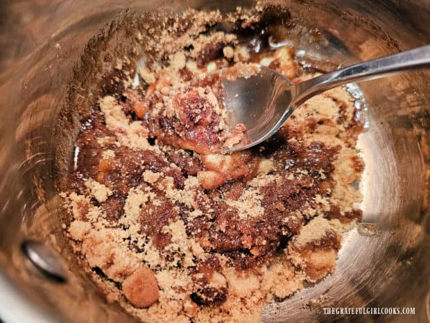 Water is added, then this "candied" mixture is heated until smooth and butter melts.