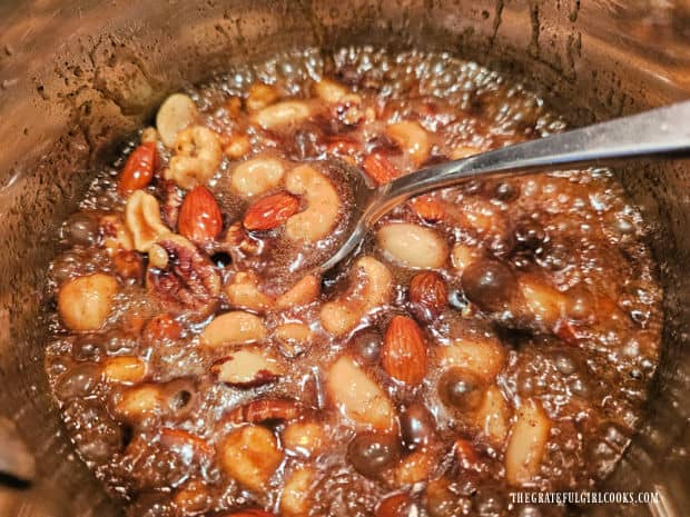 The pumpkin spice candied nuts mixture is boiled for 3 minutes