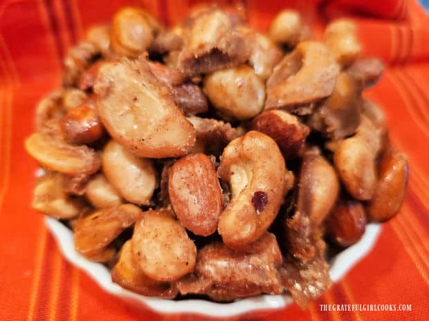 A bowl of pumpkin spice candied nuts is a perfect snack to serve at a get together.