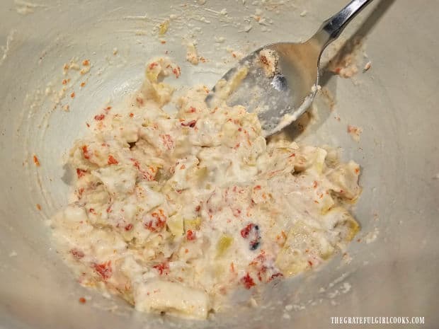 Artichoke Chicken Bake For Two - The Grateful Girl Cooks! Topping mixture for the chicken is gently stirred to combine.