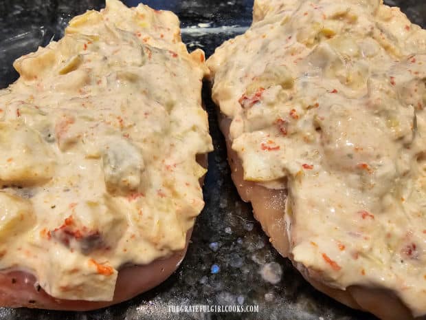 Artichoke Chicken Bake For Two - The Grateful Girl Cooks! The artichoke topping is spread over the top of the chicken breasts in the baking dish.