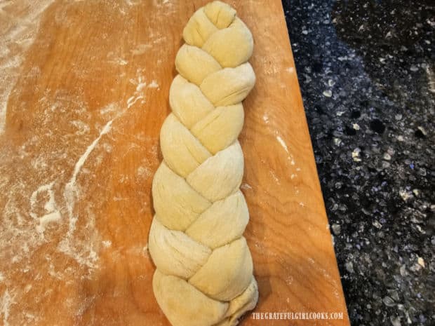 Loaf of classic challah bread once the dough has been braided.