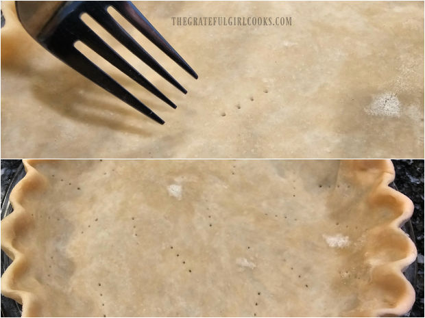 Classic Pumpkin Pie - The Grateful Girl Cooks! Pie dough is pricked with a fork and the edges are crimped into a crust.