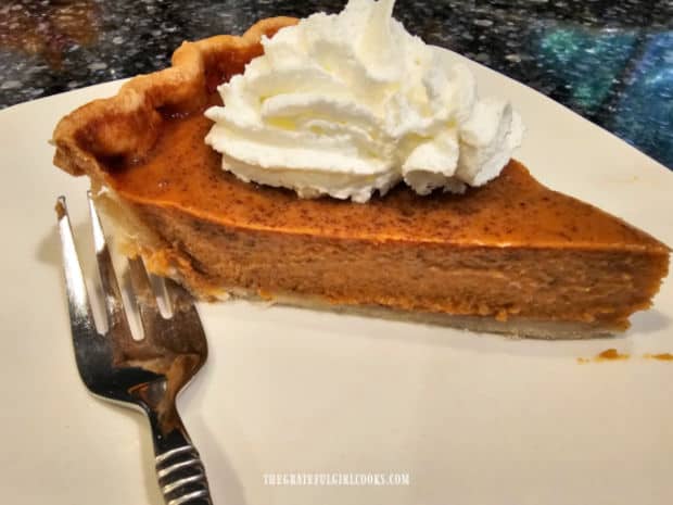 Classic Pumpkin Pie - The Grateful Girl Cooks! A side view of a slice of pie shows the creamy pumpkin filling.