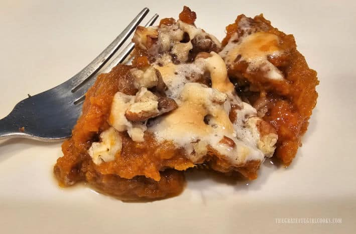 A small portion of the classic sweet potato casserole, ready to be enjoyed.