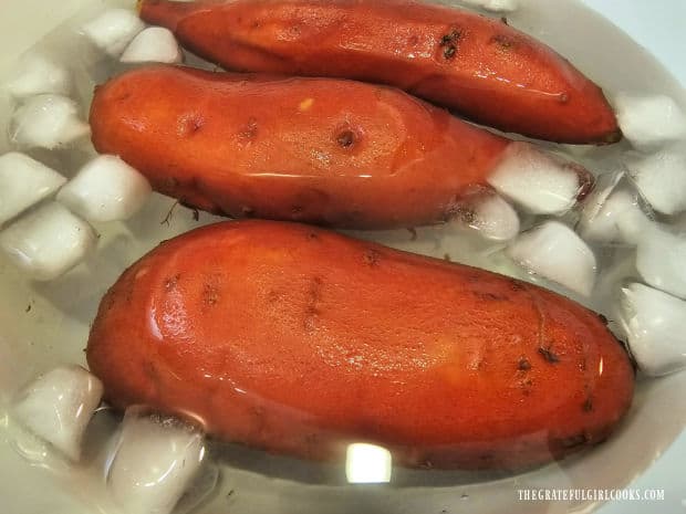 After cooking, the sweet potatoes are plunged into ice water to stop cooking process.