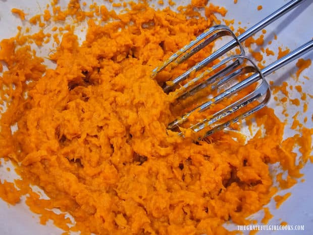 A bowl full of the mashed/beaten sweet potatoes.