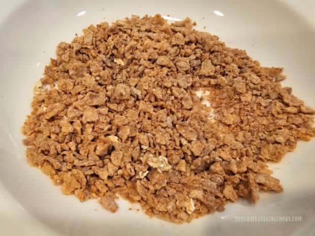 Crunchy Air Fryer French Toast - The Grateful Girl Cooks! A bowl of small crunchy bran cereal pieces, ready to use as topping for the French toast.