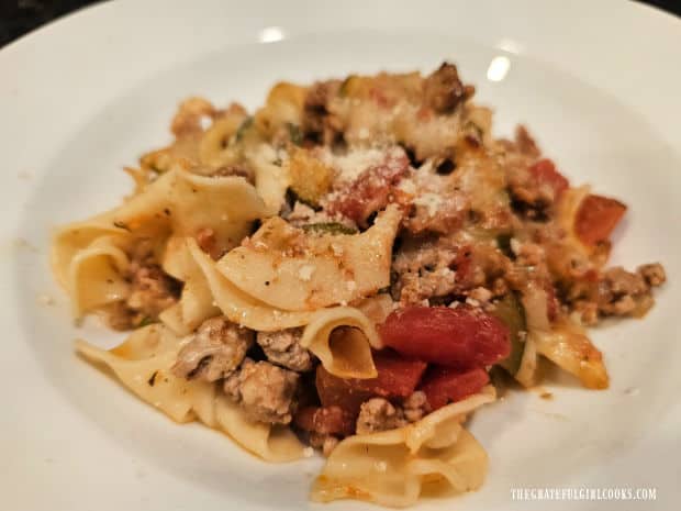 A white bowl filled with Italian Turkey Noodle Bake, ready to be eaten.