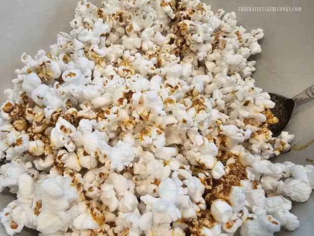 Taco Popcorn - The Grateful Girl Cooks! The popcorn is tossed to distribute the seasoning mix on the popcorn.