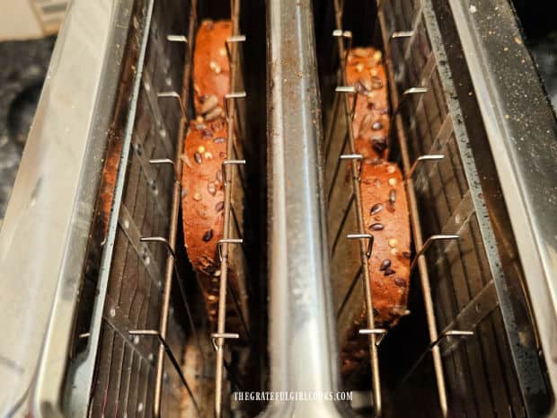 Multi-grain bread is toasted until crisp and browned.