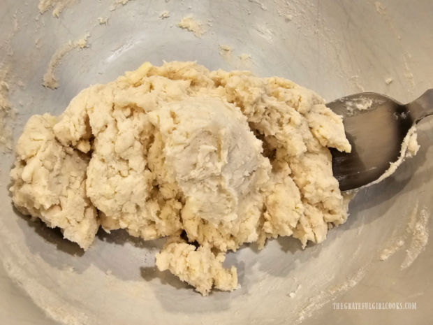 A thick dough is formed which will be used to make biscuits.