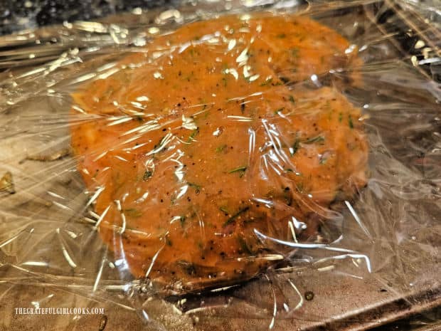 The seasoned pork butt is covered and refrigerated for between 2-24 hours.