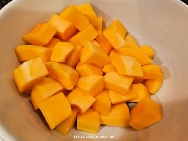 Oven-Roasted Butternut Squash - The Grateful Girl Cooks! A bowl full of cubed butternut squash slices.