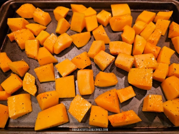 Oven-Roasted Butternut Squash - The Grateful Girl Cooks! Seasoned squash is placed on baking sheet in a single layer for roasting.