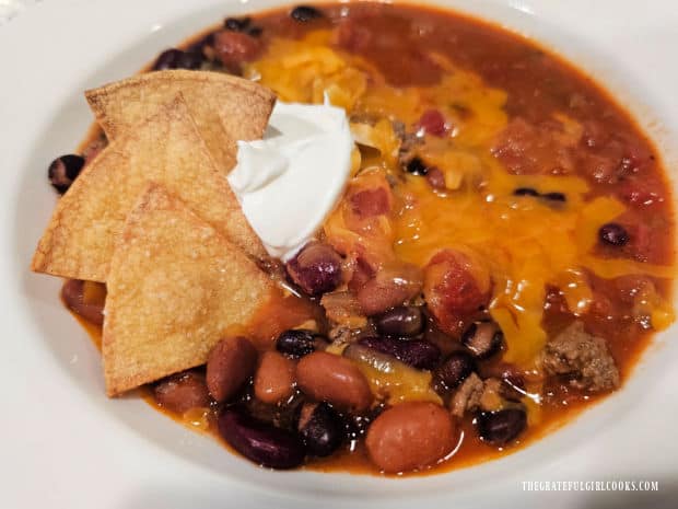 Baked Homemade Tortilla Chips served as a garnish in a bowl of chili.