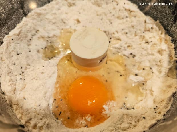 An egg and fresh lemon juice are added to the scone mixture in the food processor.