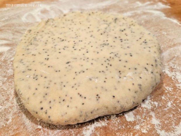 The dough is kneaded then shaped into an 8" round.