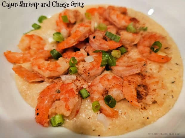 Cajun Shrimp and Cheese Grits are a delicious meal for 4! Cheesy grits are topped with Cajun-seasoned, pan-seared shrimp and creamy sauce.