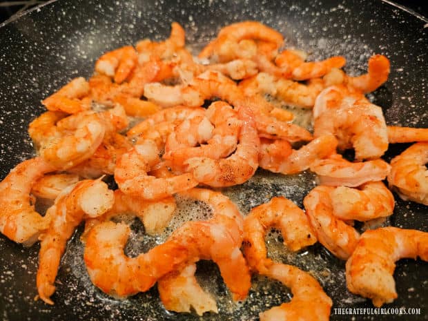 Seasoned shrimp are pan-seared in the butter and minced garlic.