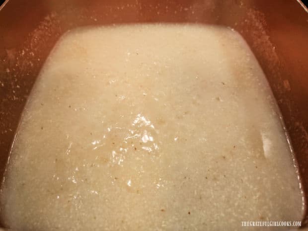 Grits are cooked in water and salt according to the package directions.