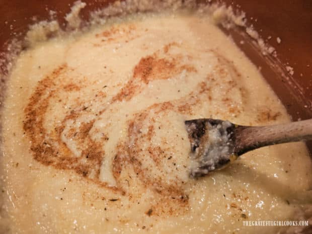 Cajun spices are stirred into the cheesy grits.