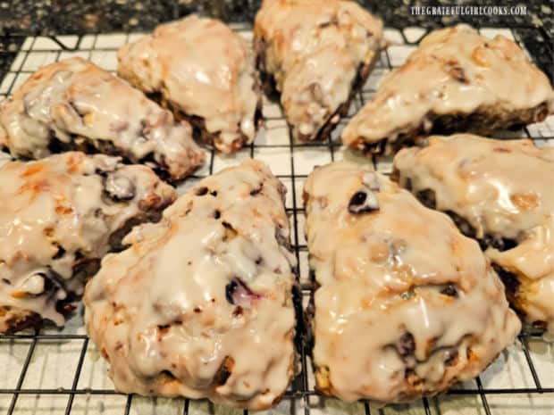 Cherry Chocolate Chip Scones - The Grateful Girl Cooks! A wire rack holds eight cherry chocolate chip scones, ready to be served.