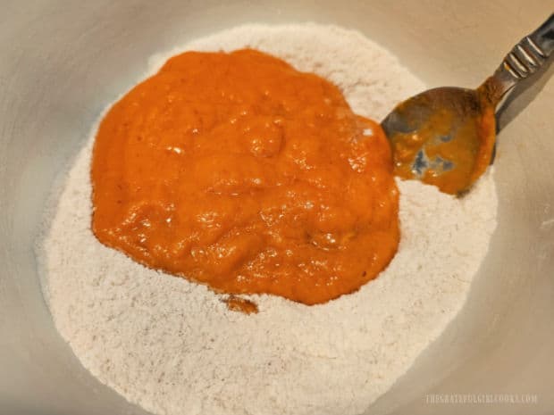 Pumpkin mixture is stirred into the dry ingredients.