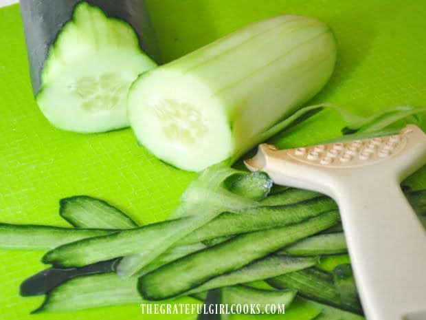 Peel is removed from cucumbers before they are sliced.