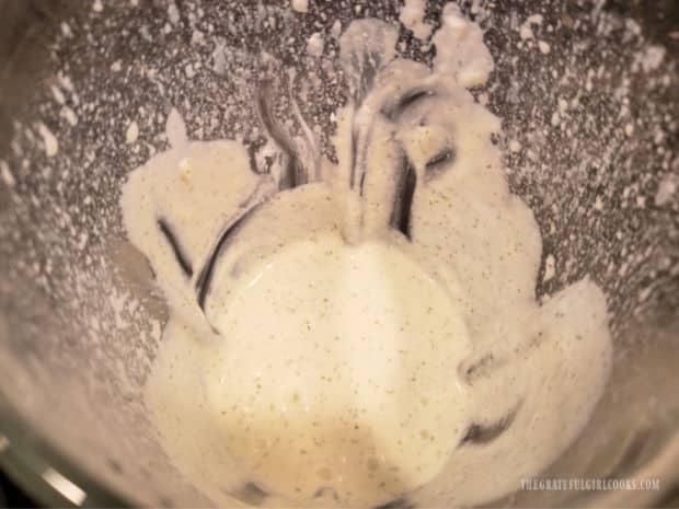Ingredients are blended until they become smooth for the tzatziki sauce.