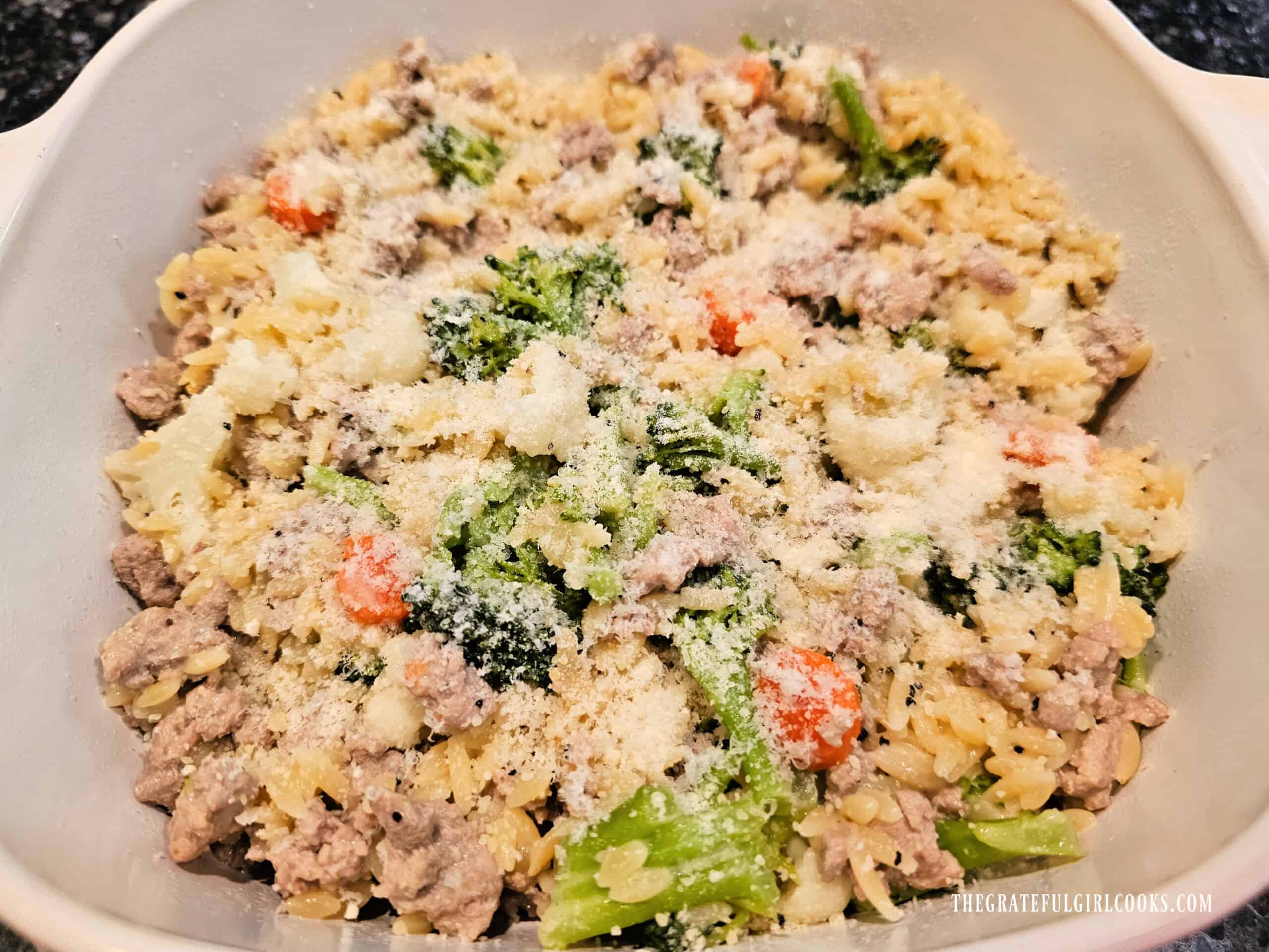 Turkey Veggie Orzo Skillet - The Grateful Girl Cooks! Topped with additional Parmesan, the turkey veggie orzo skillet is served hot.
