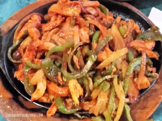 Fajita Seasoning Mix - The Grateful Girl Cooks! A large serving of chicken and beef fajitas with onions and multi-colored peppers.