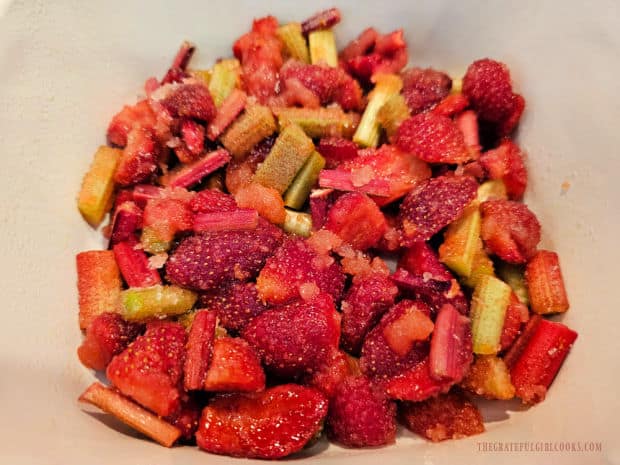 Prepared fruit filling is spread in the bottom of a baking dish.