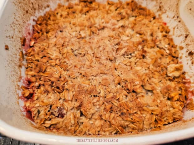 After cooking, the air fryer strawberry rhubarb crisp is golden brown and bubbly.