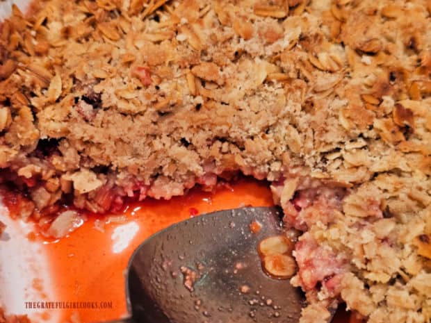 A look at the juices in the strawberry rhubarb crisp after a portion is removed.