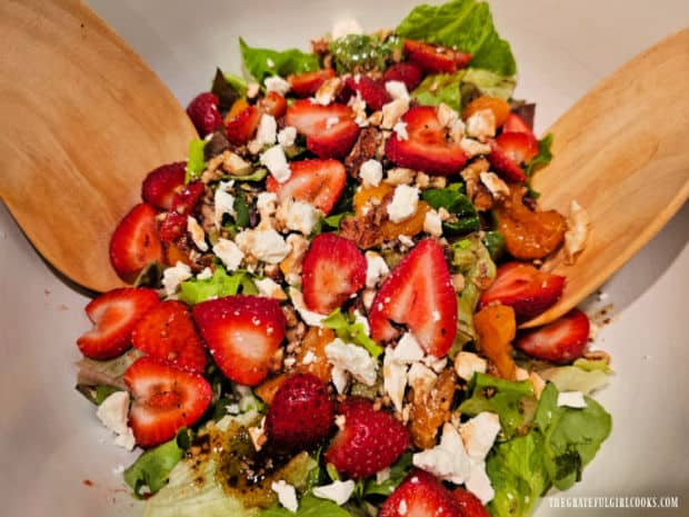 Chicken Strawberry Delight Salad - The Grateful Girl Cooks! The salad is tossed with tongs after the vinaigrette has been added.