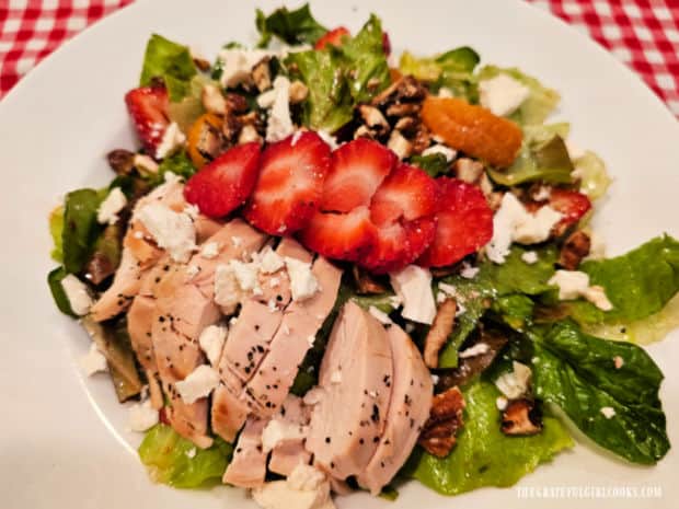 Chicken Strawberry Delight Salad - The Grateful Girl Cooks! Chicken slices, strawberries and feta garnish the finished salad.
