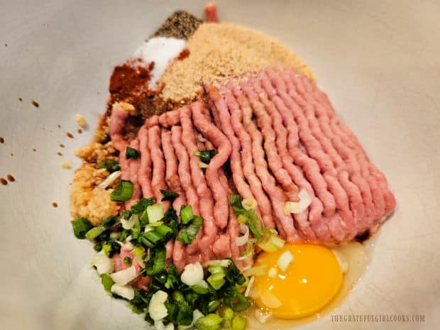 Ingredients for the turkey meatballs are placed in a bowl.