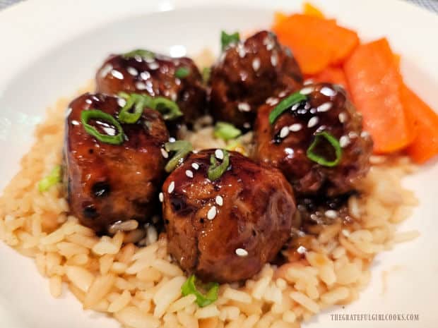 The honey garlic turkey meatballs on rice pilaf with cooked carrots on the side.