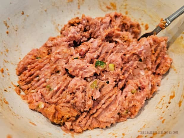 Meatball ingredients are combined into a cohesive mixture.