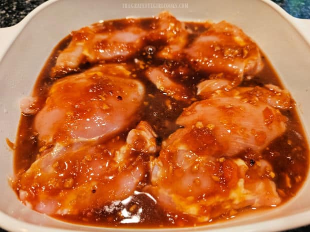 Apricot Glazed Chicken Thighs - The Grateful Girl Cooks! The apricot glaze is poured over the chicken thighs before baking.
