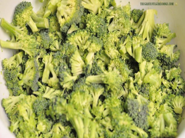 The fresh broccoli is cut into small florets.