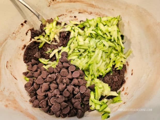 Semi-sweet chocolate chips and shredded zucchini are added to cake batter.
