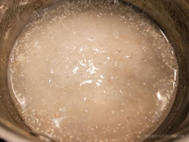 Egg Topped Cheesy Grits - The Grateful Girl Cooks! Grits are stirred a few times while they are cooking.