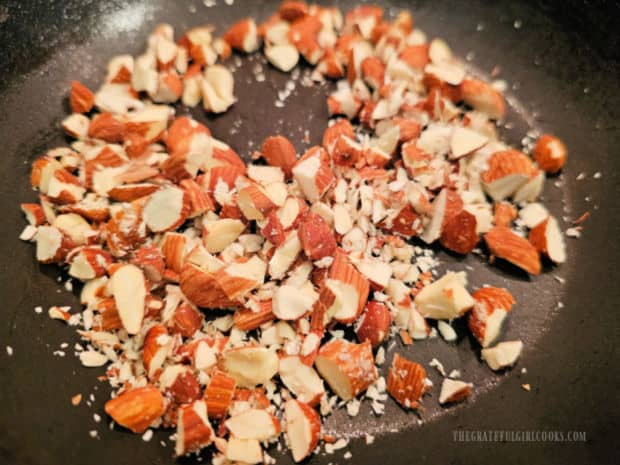 Raspberry Coconut Overnight Oats - The Grateful Girl Cooks! Chopped raw almonds are lightly toasted in a dry skillet.