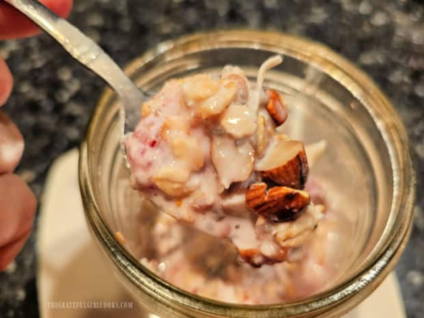 Raspberry Coconut Overnight Oats - The Grateful Girl Cooks! A spoonful of raspberry coconut overnight oats ready to be enjoyed.
