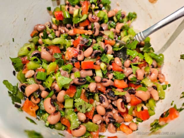 Texas Caviar - The Grateful Girl Cooks! The Texas caviar is stirred to combine all of the ingredients.