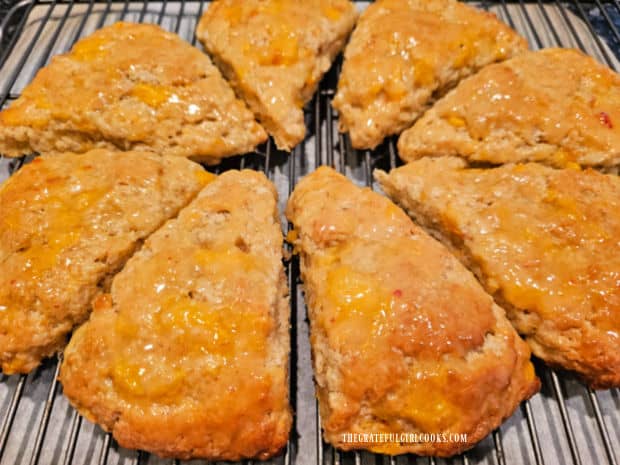 Glazed Peach Scones - The Grateful Girl Cooks! Eight glazed peach scones continue cooling on a wire rack.