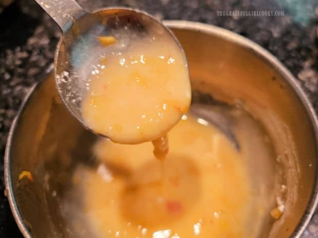 Glazed Peach Scones - The Grateful Girl Cooks! Peach icing is ready to be brushed on cooled, baked scones.